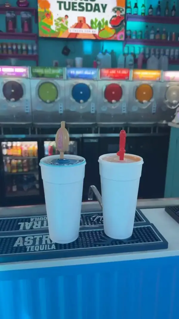 Two daiquiris with novelty party straws on Taco Tuesday
